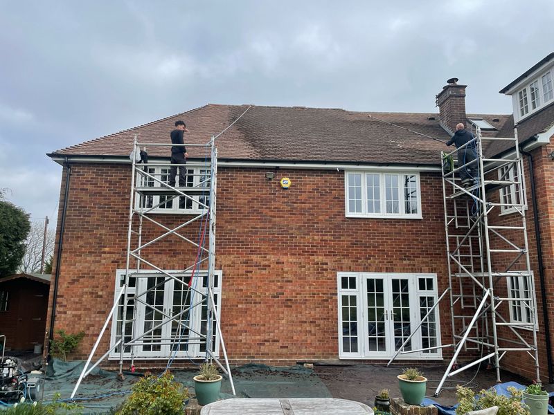 Roof cleaning carried out safely from scaffold towers by The Roof Moss Cleaners in Stotfold